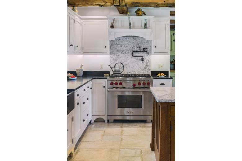 Modern Kitchen with a Stainless Steel Stove and Granite Counters