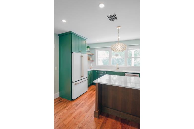 Kitchen with Emerald Green Cabinets and White Granite Countertops