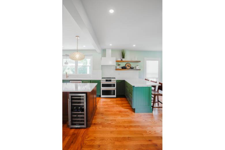 Kitchen with Green Cabinets and White Countertops