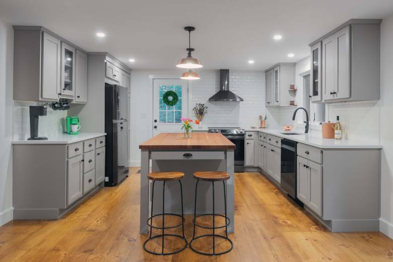 Kitchen Remodel with white subway tile and grey cabinets with butcherblock