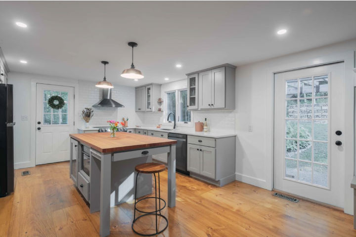 Kitchen renovation with grey cabinets and butcherblock island