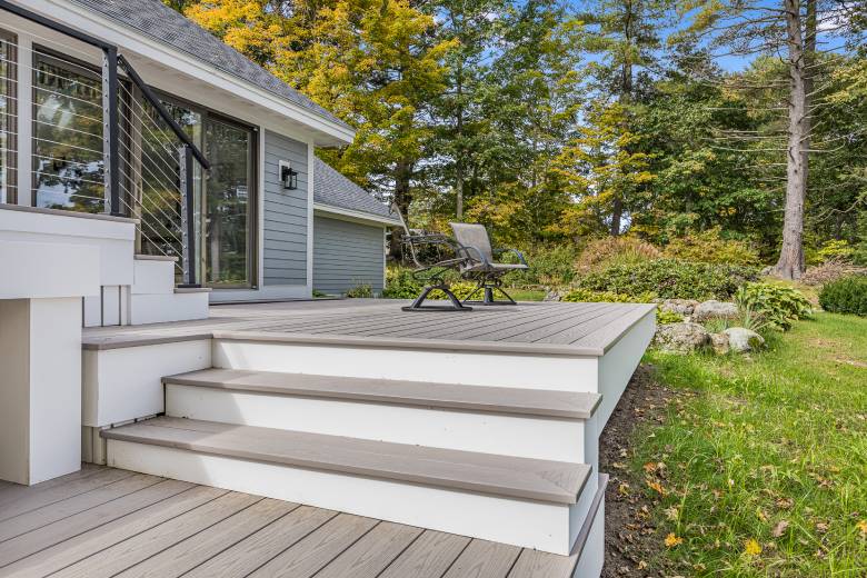 Modern deck with steps leading down to yard