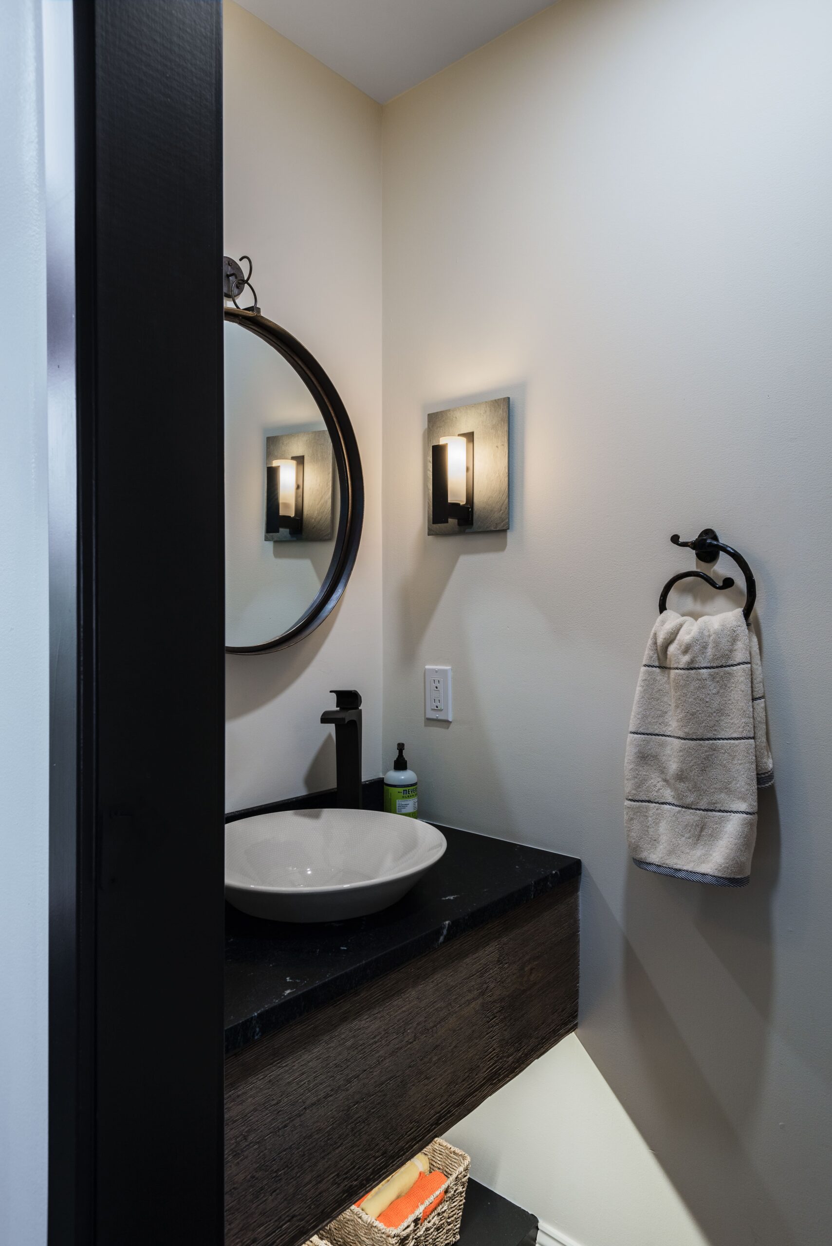 modern bathroom with a sink, mirror and towel rack