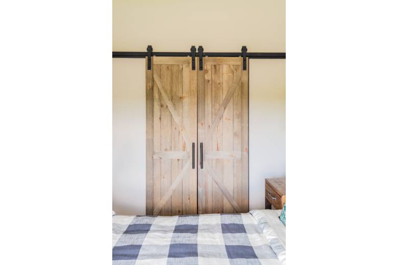 Wooden Bran Doors in a Bedroom