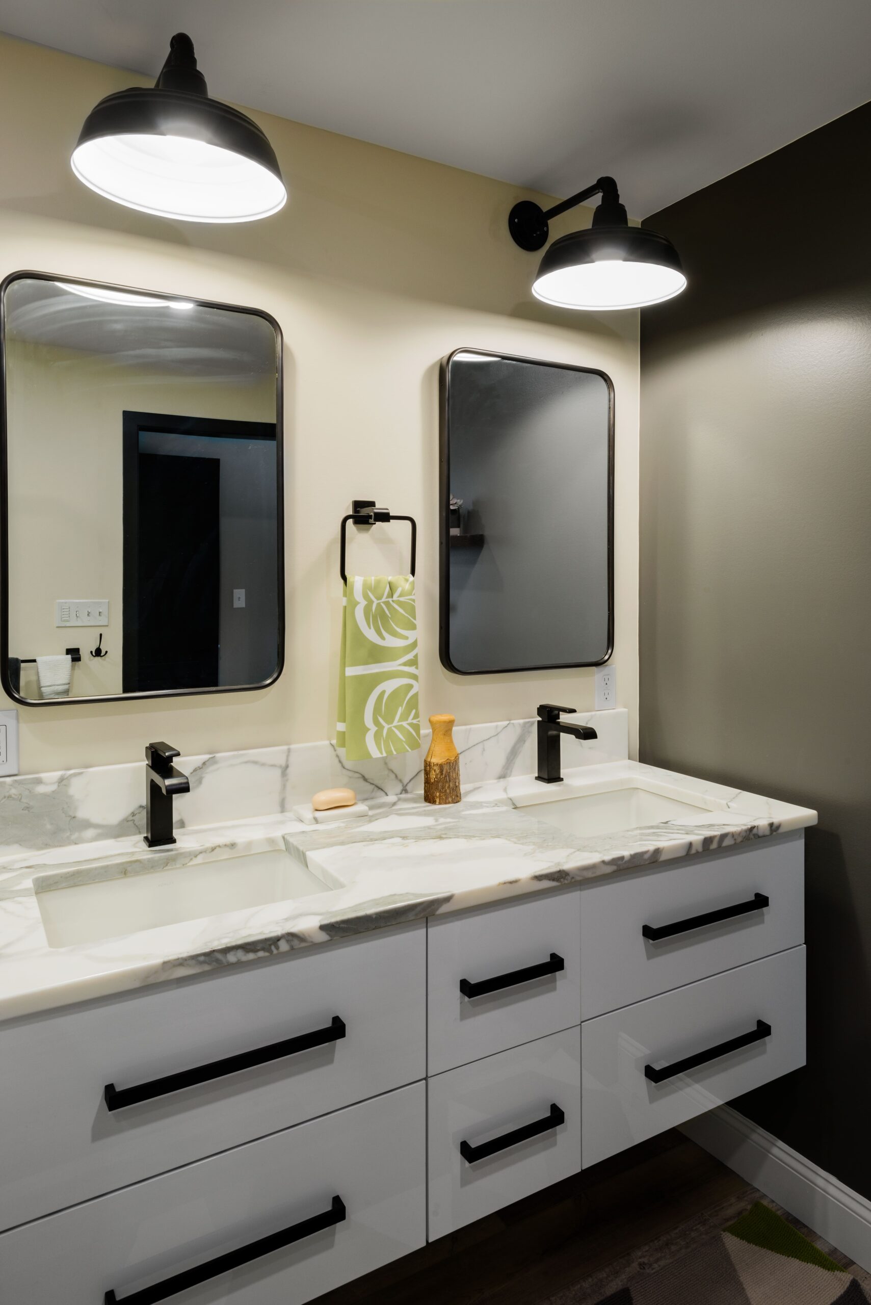 Modern double vanity with black fixtures and white cabinets